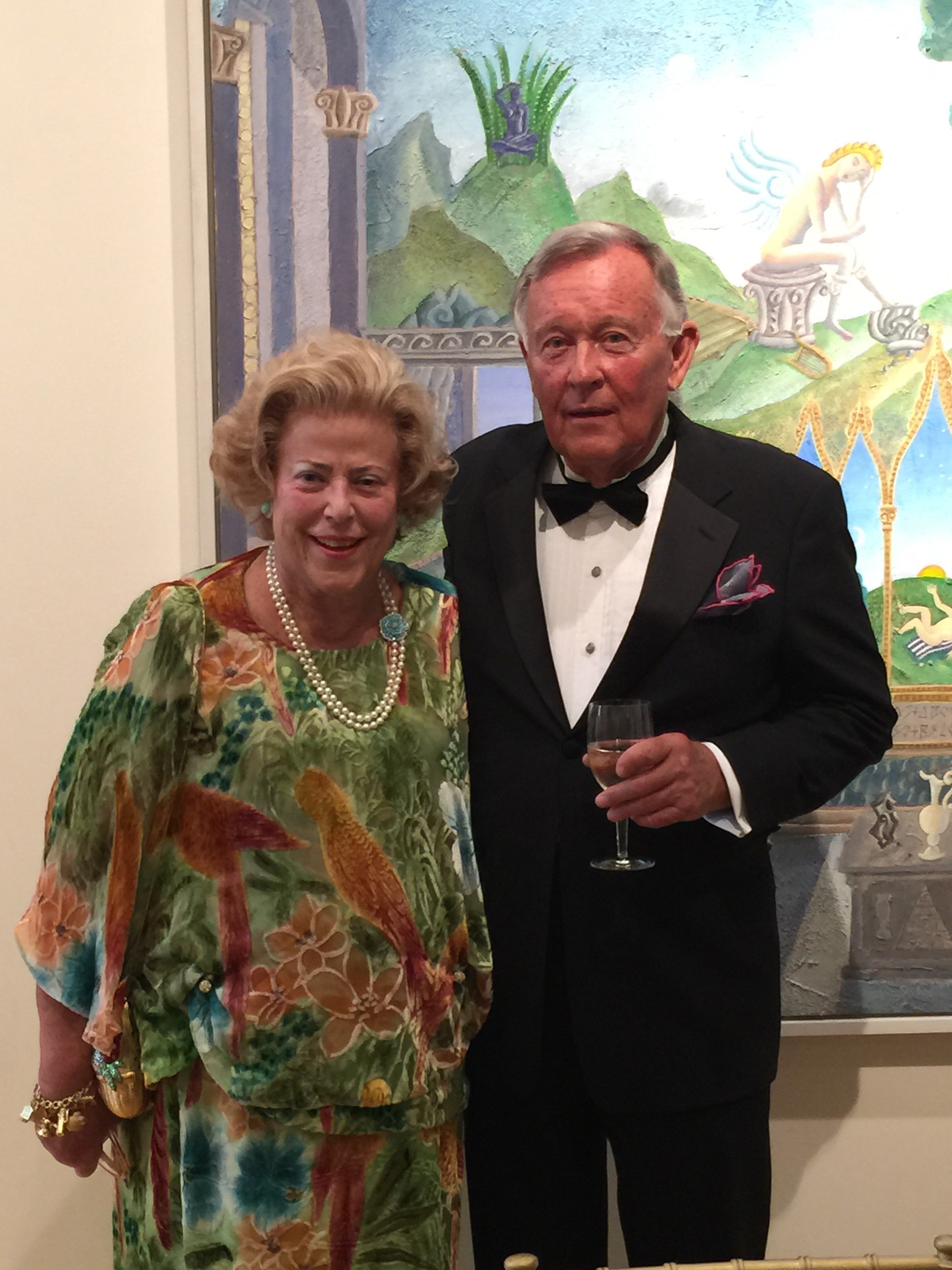 Melinda Sullivan and Thomas McKnight in front of his painting at the 20th century wing at the New Britain Museum of American Art